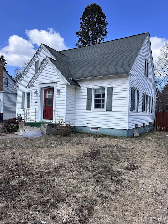 bungalow with fence and a shingled roof