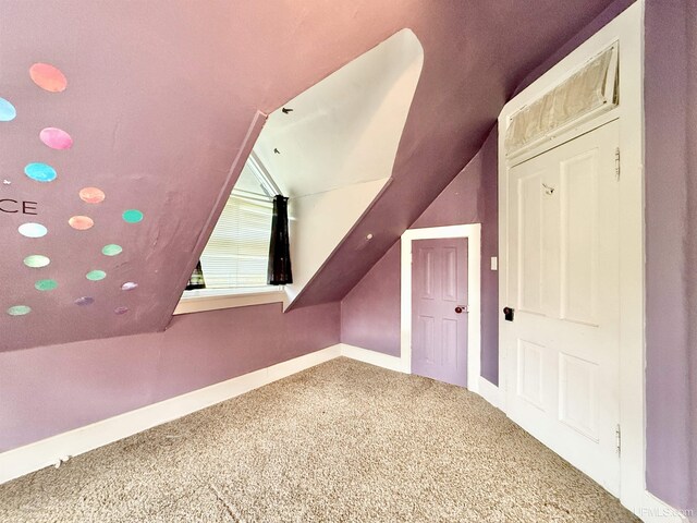 404 Lake Shore Dr, Escanaba, MI 49829 - bonus room featuring carpet floors, baseboards, and vaulted ceiling