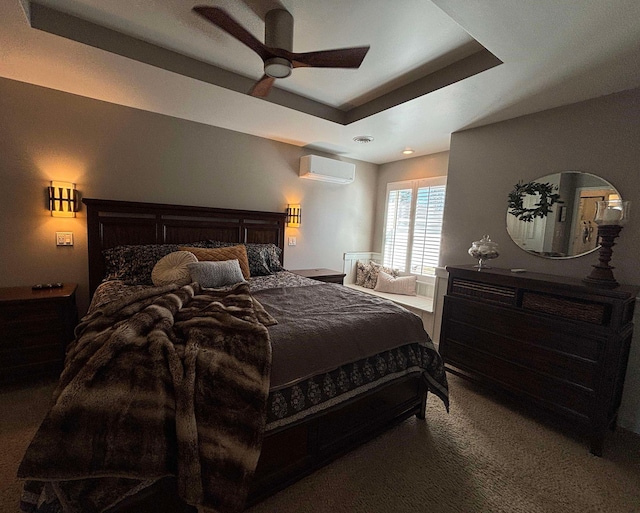 bedroom with visible vents, a raised ceiling, ceiling fan, a wall mounted AC, and carpet flooring