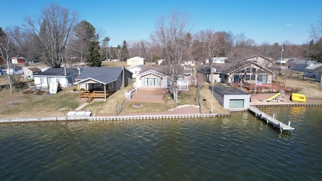 view of dock with a deck with water view and a residential view