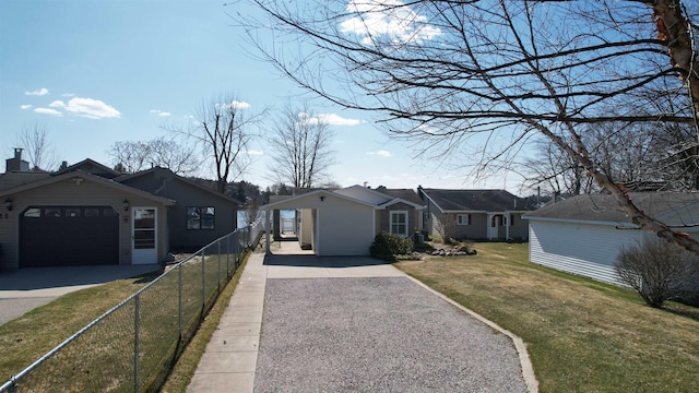 ranch-style home with fence, gravel driveway, and a front lawn