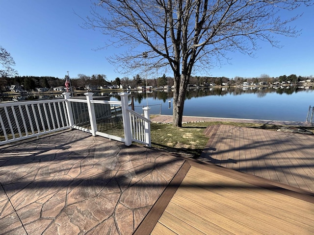 wooden deck with a water view