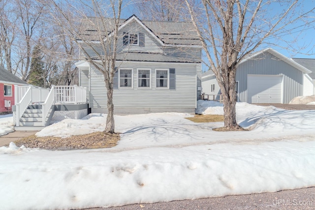 104 Birch St, Bergland, MI 49910 - view of front of house with an outbuilding and a detached garage
