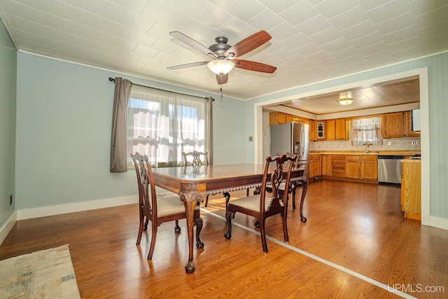 104 Birch St, Bergland, MI 49910 - dining area with crown molding, a ceiling fan, and a wealth of natural light