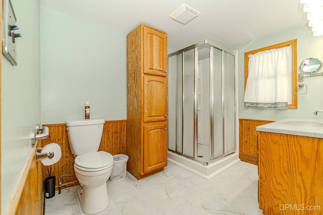104 Birch St, Bergland, MI 49910 - bathroom featuring visible vents, toilet, marble finish floor, wainscoting, and a stall shower