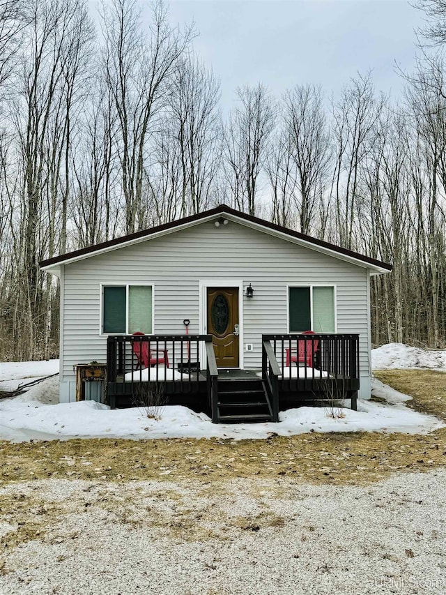 view of front of property with a wooden deck