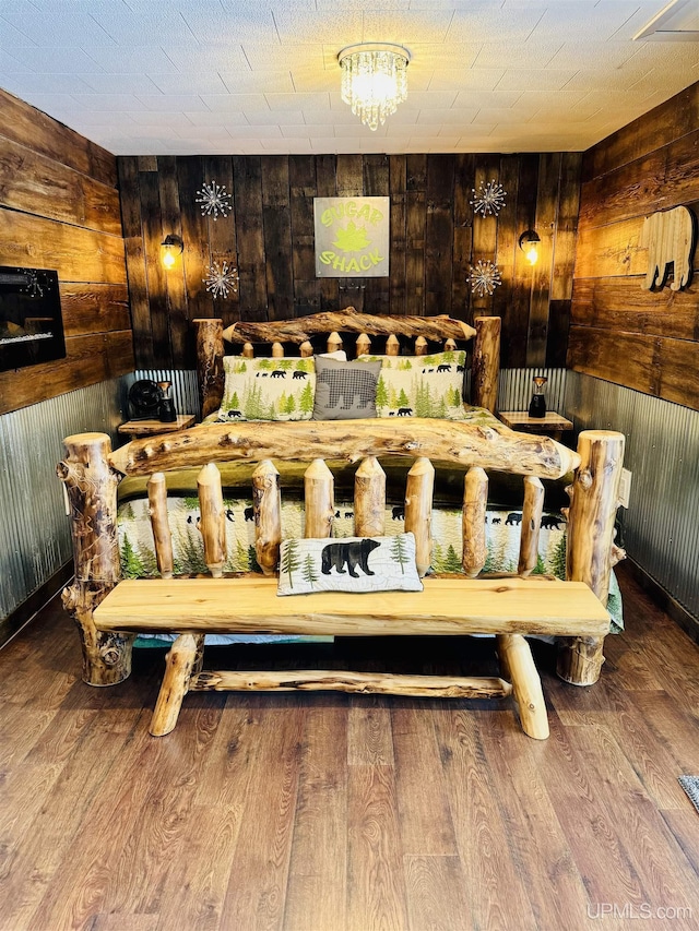 interior space with wooden walls and wood finished floors