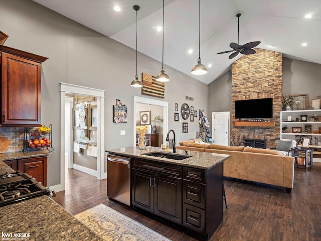 kitchen featuring high vaulted ceiling, dark wood-type flooring, ceiling fan, stainless steel dishwasher, and a sink