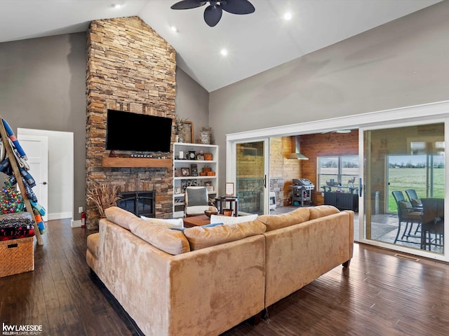 living room featuring ceiling fan, a fireplace, recessed lighting, wood-type flooring, and high vaulted ceiling