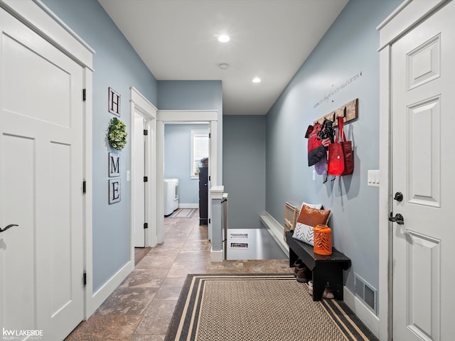 interior space featuring washer / dryer, visible vents, baseboards, and recessed lighting