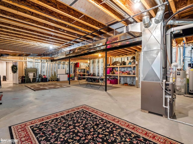 unfinished basement featuring gas water heater