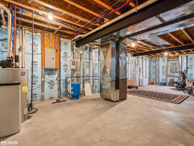 unfinished below grade area with heating unit, electric panel, and water heater