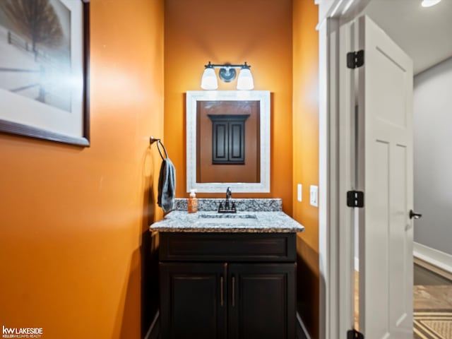 bathroom featuring baseboards and vanity