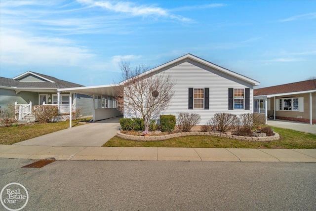 6240 Twin Lakes Dr, Kimball, MI 48074 - view of front facade with a carport and driveway