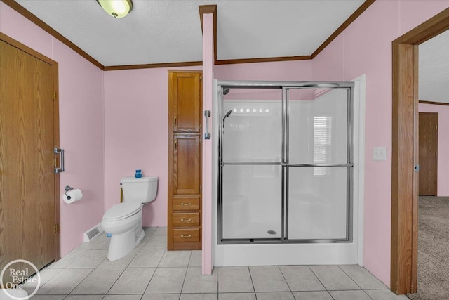 6240 Twin Lakes Dr, Kimball, MI 48074 - bathroom with crown molding, tile patterned flooring, visible vents, toilet, and a stall shower