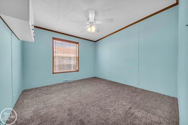 6240 Twin Lakes Dr, Kimball, MI 48074 - carpeted empty room with vaulted ceiling, ornamental molding, a textured ceiling, visible vents, and ceiling fan