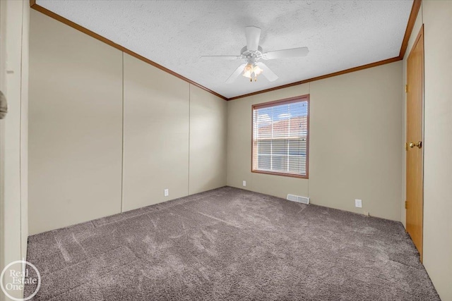 6240 Twin Lakes Dr, Kimball, MI 48074 - empty room featuring ornamental molding, carpet flooring, a textured ceiling, a ceiling fan, and lofted ceiling