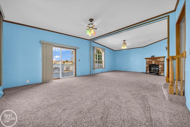 6240 Twin Lakes Dr, Kimball, MI 48074 - unfurnished living room with ornamental molding, carpet floors, ceiling fan, and a glass covered fireplace