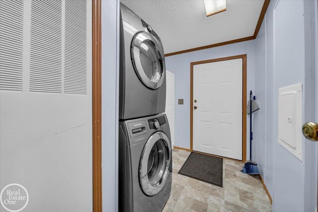 6240 Twin Lakes Dr, Kimball, MI 48074 - washroom featuring stone finish floor, stacked washer / drying machine, baseboards, and a heating unit