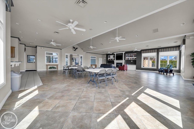 6240 Twin Lakes Dr, Kimball, MI 48074 - dining room with high vaulted ceiling, visible vents, baseboards, and a ceiling fan