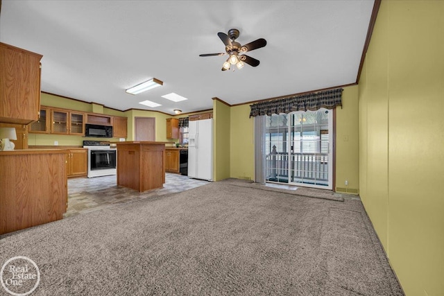 6240 Twin Lakes Dr, Kimball, MI 48074 - kitchen featuring open floor plan, black appliances, light colored carpet, and a ceiling fan