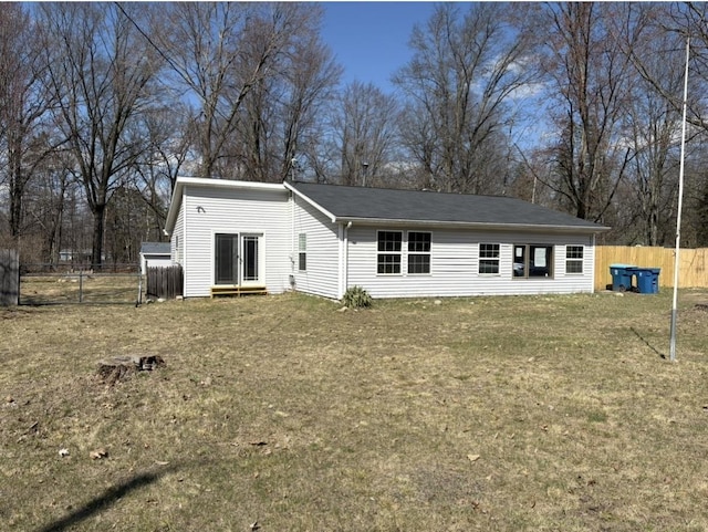 view of front of property with a front yard and fence