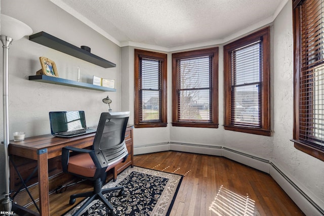 home office with dark wood finished floors, a textured ceiling, baseboard heating, a textured wall, and baseboards