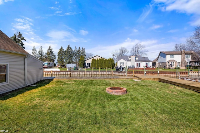 view of yard featuring an outdoor fire pit