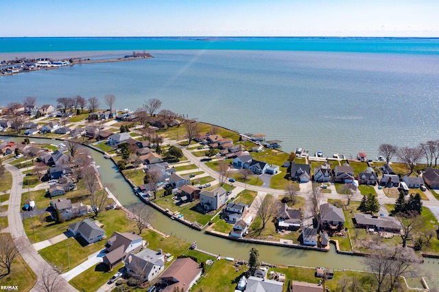 birds eye view of property featuring a water view and a residential view