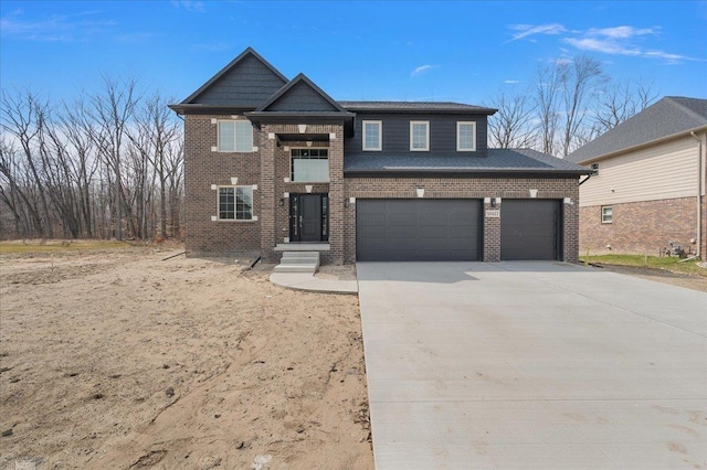 view of front of property featuring a garage, brick siding, and driveway