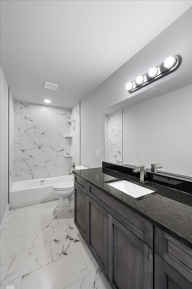 bathroom with visible vents, toilet, vanity, marble finish floor, and bathing tub / shower combination