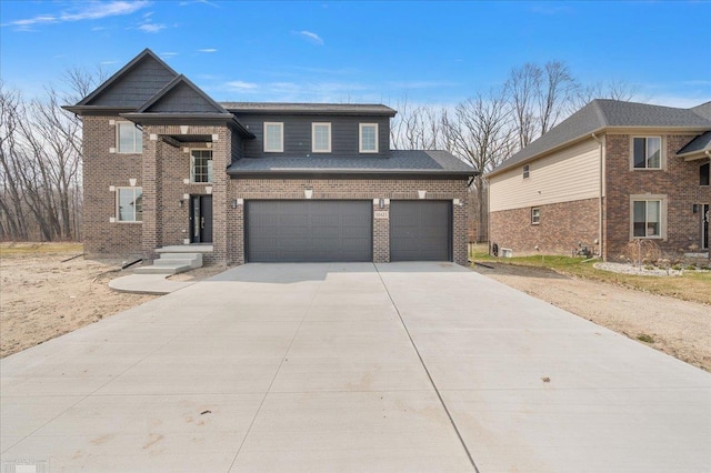 traditional-style house featuring brick siding, driveway, and an attached garage