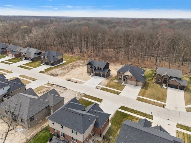 aerial view featuring a residential view and a view of trees