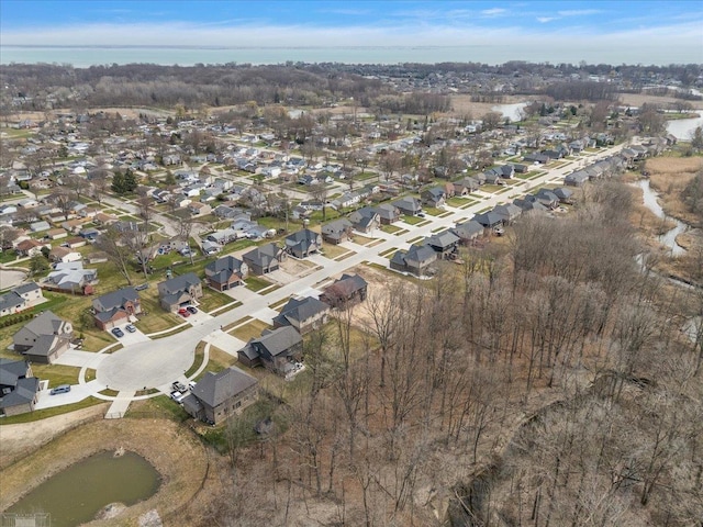 birds eye view of property featuring a water view and a residential view