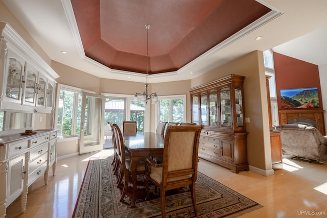 dining space with light wood-style floors, a tray ceiling, recessed lighting, a chandelier, and baseboards