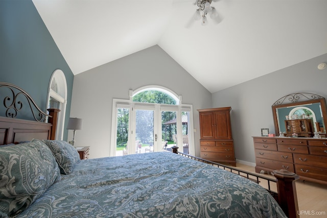 bedroom featuring access to outside, french doors, and high vaulted ceiling