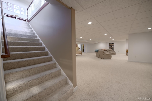 stairway with recessed lighting, carpet, and baseboards