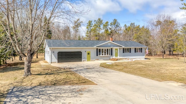 single story home featuring a chimney, an attached garage, a front lawn, and concrete driveway