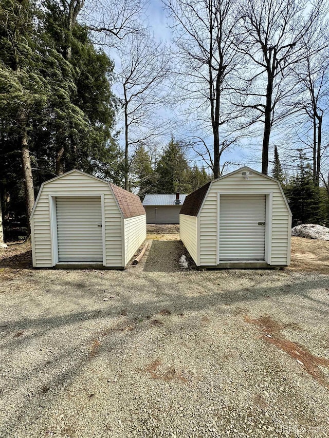 garage featuring a storage unit
