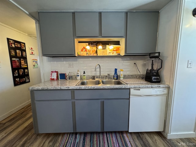 9260 S US Highway 41, Skandia, MI 49885 - kitchen with tasteful backsplash, gray cabinets, dark wood-type flooring, white dishwasher, and a sink
