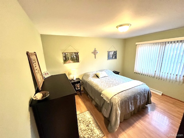 bedroom with wood finished floors