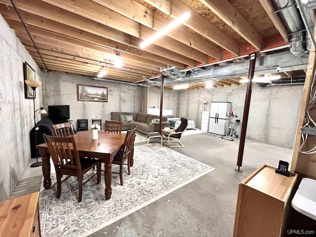 dining room featuring unfinished concrete floors
