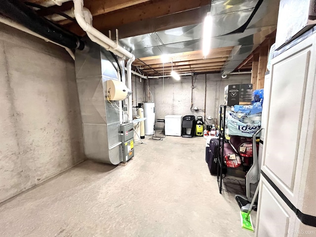 unfinished below grade area with heating unit and gas water heater