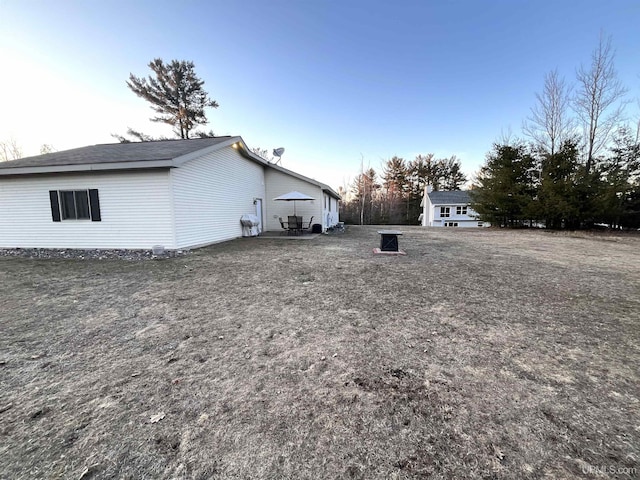 view of side of property with a patio area
