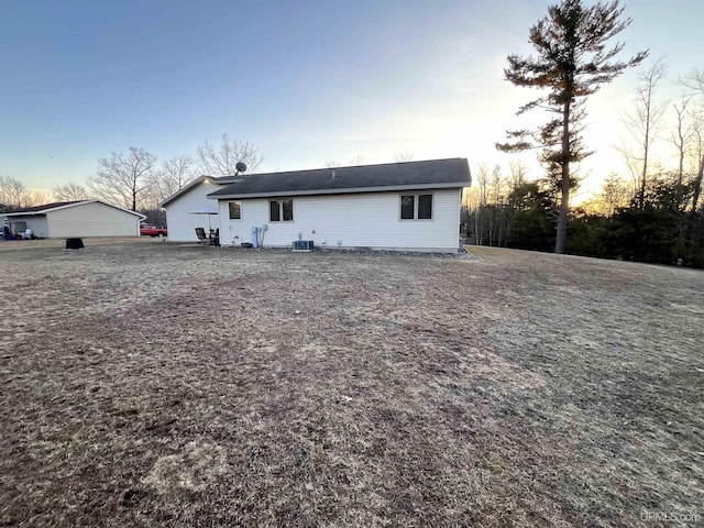 rear view of property featuring central AC