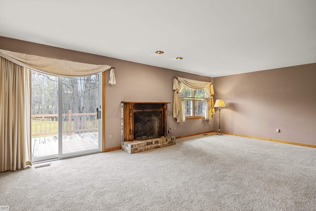 475 S Bartlett Rd, Saint Clair, MI 48079 - unfurnished living room with baseboards, a brick fireplace, visible vents, and carpet