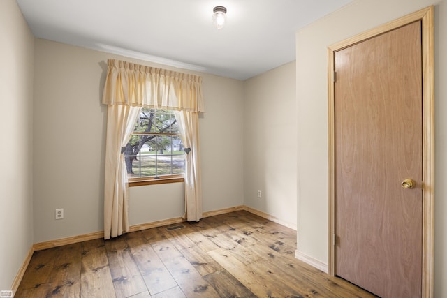 475 S Bartlett Rd, Saint Clair, MI 48079 - empty room with baseboards, hardwood / wood-style floors, and visible vents