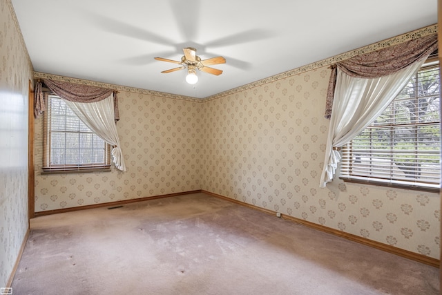 475 S Bartlett Rd, Saint Clair, MI 48079 - carpeted spare room featuring visible vents, wallpapered walls, a ceiling fan, and baseboards