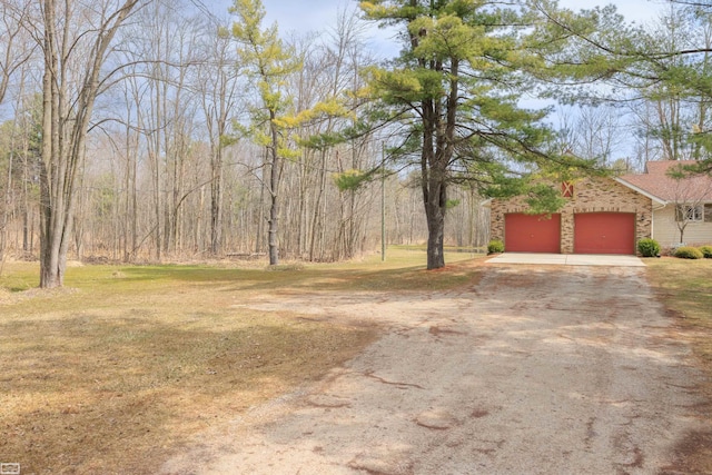 475 S Bartlett Rd, Saint Clair, MI 48079 - view of yard featuring an attached garage and driveway
