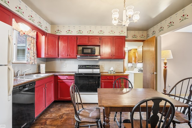 475 S Bartlett Rd, Saint Clair, MI 48079 - kitchen featuring dark wood finished floors, black appliances, a sink, and wallpapered walls